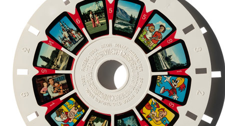 (660) showing white reel with twelve small of families and cartoon characters reel,...