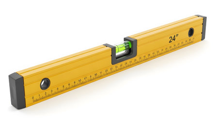 Stock showing yellow 24 inch spirit level tool with green bubble and measurement markings on...