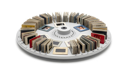 showing circular slide carousel organizer filled with vintage photographic slides and...