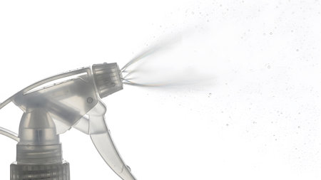 Mist showing clear spray bottle nozzle releasing a fine mist of water droplets. resolution...