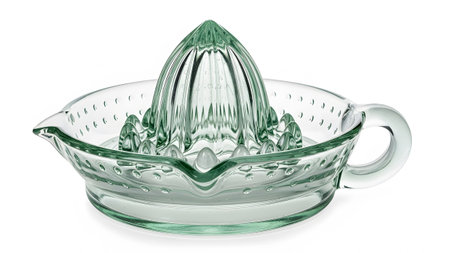 Glass showing clear glass citrus juicer with ribbed reamer and bubble texture in bowl on white...