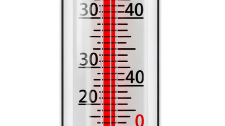 Close showing close up of a thermometer with a red liquid column indicating a temperature...