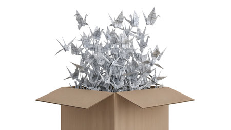 Open showing numerous white origami cranes bursting out of an open cardboard box.の写真素材