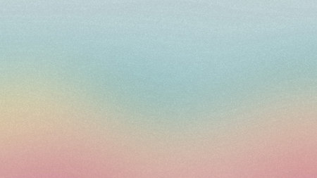 A soft focus gradient blends pastel pink, yellow, and light blue hues with a subtle grainy...の写真素材