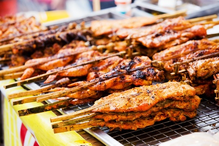 Grilling chicken plugged with bamboo, Local Foods of Thailandの写真素材