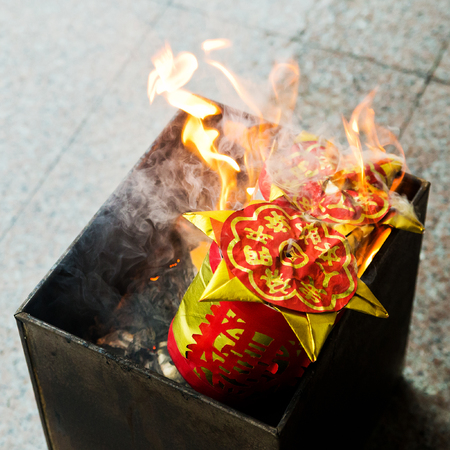 A custom in Chinese  People burn the Ghost Money and paper materials to honor the ancestor in festival so that their ancestor still can rich in heaven or hill の写真素材
