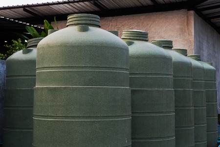 Large eco- friendly water storage tank in suburban backyardの写真素材