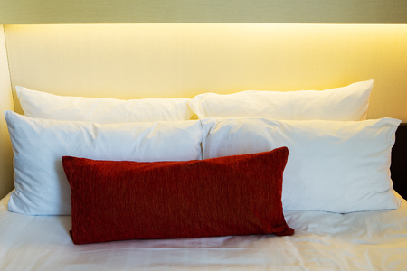 Comfortable soft pillows on the bedの写真素材