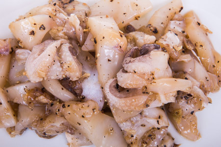 Squid marinated with garlic, pepper, sliced
