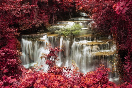 Waterfall,Level four of Waterfall Huai Mae Kamin in Kanchanaburi,Thailand, Style light red backgroundの写真素材