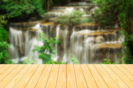 Defocus and blur image of terrace wood and Beautiful waterfall in morning time for background usageの写真素材