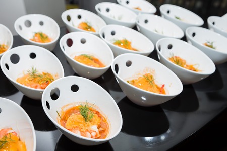 Shrimp with white wine sauce on tableの写真素材
