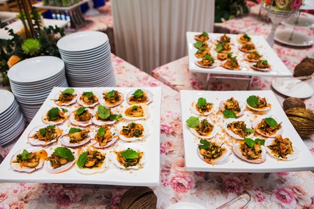 Spicy scallops on white plate in partyの写真素材