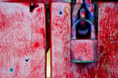 Red locked old with wooden door for backgroundの写真素材