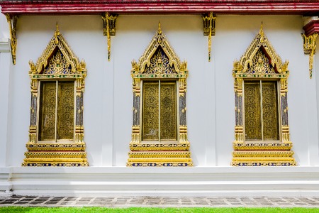 The religion art of Thai Buddhist temple windowsの写真素材