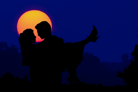 wedding couple with the sunset in ceremonyの写真素材
