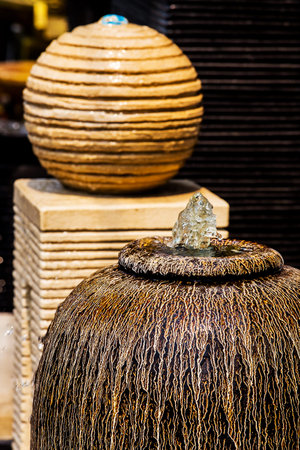 Colored of jars in the garden on groundの写真素材