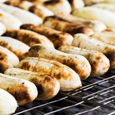 Grilled banana or Roasted banana in Thai style Traditional, Dessert by grilling banana on the hot charcoalの写真素材