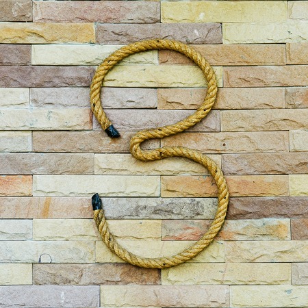 Rope Number tree Alphabet on stone backgroundの写真素材