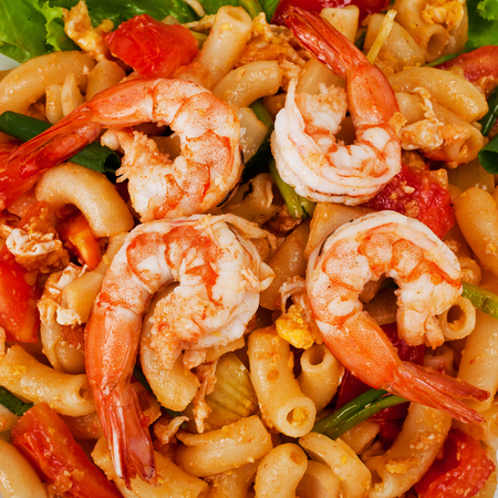 Macaroni with shrimp and tomato sauce food.の写真素材