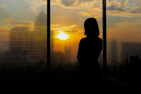 Businessmen in a sunset on the tallest building in Bangkok.の写真素材