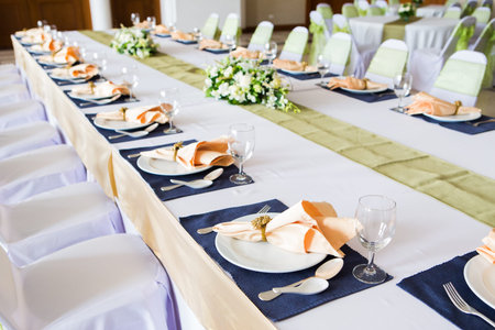 Table with the glasses and plates for party