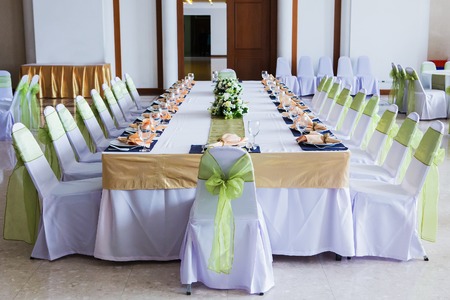 Table with the glasses and plates for partyの写真素材