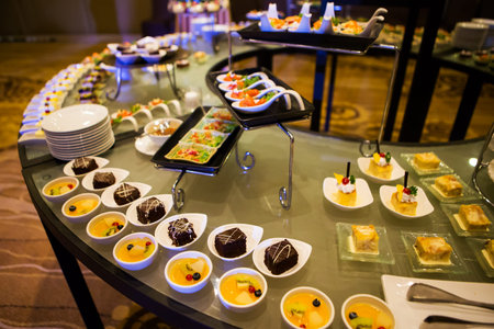 Close-up view of dessert buffet with delicious sweet bakery and coffee-shakes