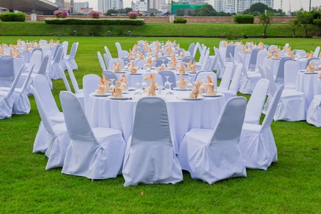 gorgeous wedding chair and table setting for fine dining at outdoorsの写真素材