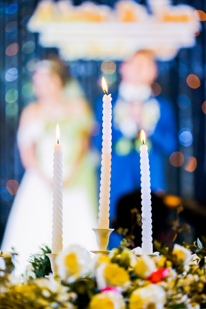 Wedding candle and  bride ,groom in ceremonyの写真素材
