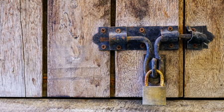 Wood Locked door with key on backgroundの写真素材