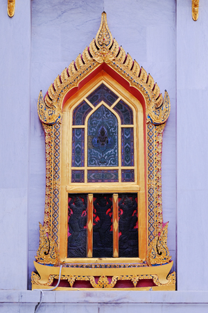 The religion art of Thai Buddhist temple windowsの写真素材