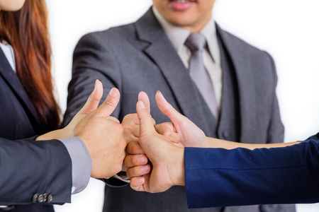 Group of business people meeting shaking hands together, business outdoor meeting concept.の写真素材