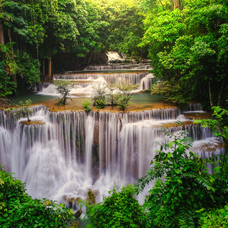 Waterfall in deep rain forest jungle (Huay Mae Kamin Waterfall in Kanchanaburi Province, Thailand)の写真素材