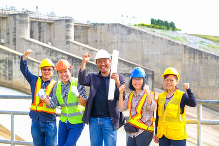 Engineering team Men and woman meeting with Engineers and supervisors are standing reading the...