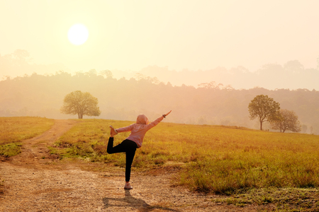 Asian women with morning exercises in yoga posturesの写真素材