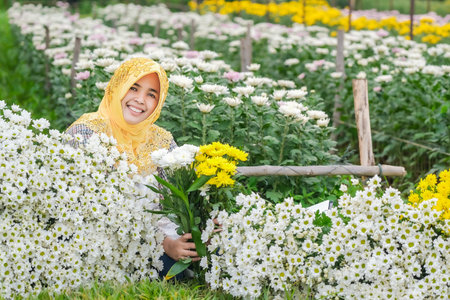 Muslim people and chrysanthemum collection in the garden