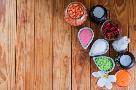 Herbal compress and salt, massage products for good health on a wooden tableの写真素材