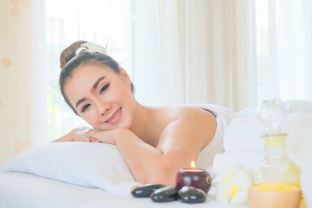 Beautiful woman relaxing in spa salon. Body care, Spa body massage treatment. Relaxation, Beauty and Health care concept.の写真素材