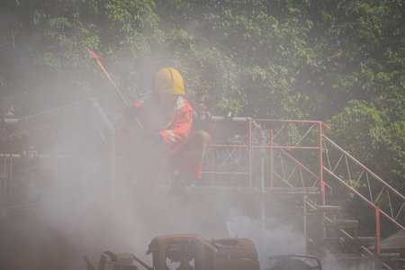 Firefighter are using fire hatchet job / Fire and rescue training school regularly to get ready -...