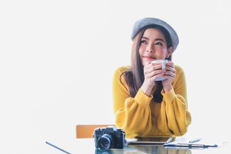 Beautiful Asian women drink coffee at home with a refreshing face.の写真素材