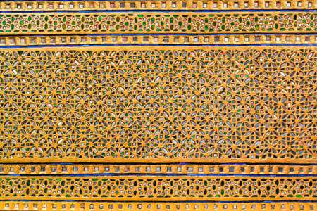 Thai carved wood and Thai mythological motifs decorated with gold and stained glass.