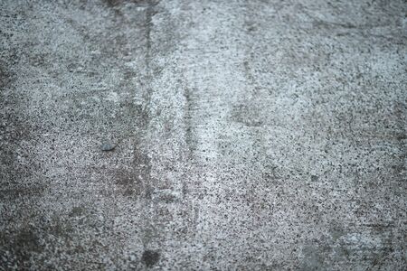 White old cement wall concrete backgrounds textured. Abstract vintage texture. Background from cracks, breaks, stains. Grunge cracks, damageの写真素材