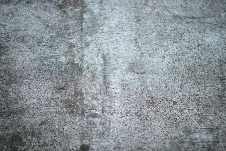 White old cement wall concrete backgrounds textured. Abstract vintage texture. Background from cracks, breaks, stains. Grunge cracks, damageの写真素材