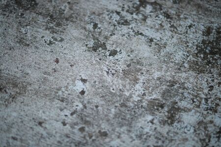 White old cement wall concrete backgrounds textured. Abstract vintage texture. Background from cracks, breaks, stains. Grunge cracks, damageの写真素材