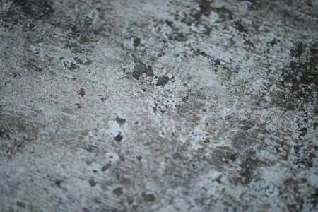 White old cement wall concrete backgrounds textured. Abstract vintage texture. Background from cracks, breaks, stains. Grunge cracks, damageの写真素材