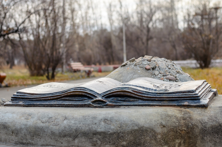 Metal sculpture in the form of an open book with the imprint of the palm. Grants wishes.の写真素材
