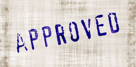 The word 'approved' on a worn and grungy backgroundの写真素材
