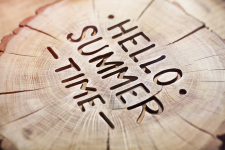 Hello summer time decorative wood carving, background. positive quote for design. Hand lettering inspirational typography poster, photo banner.の写真素材