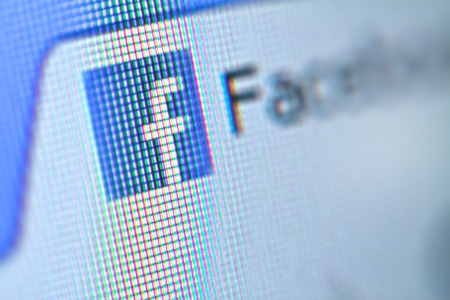 Facebook social media app logo on log-in, sign-up registration page on mobile app screen on smart devices in business person's work official website is 2018 - 2019.のeditorial素材